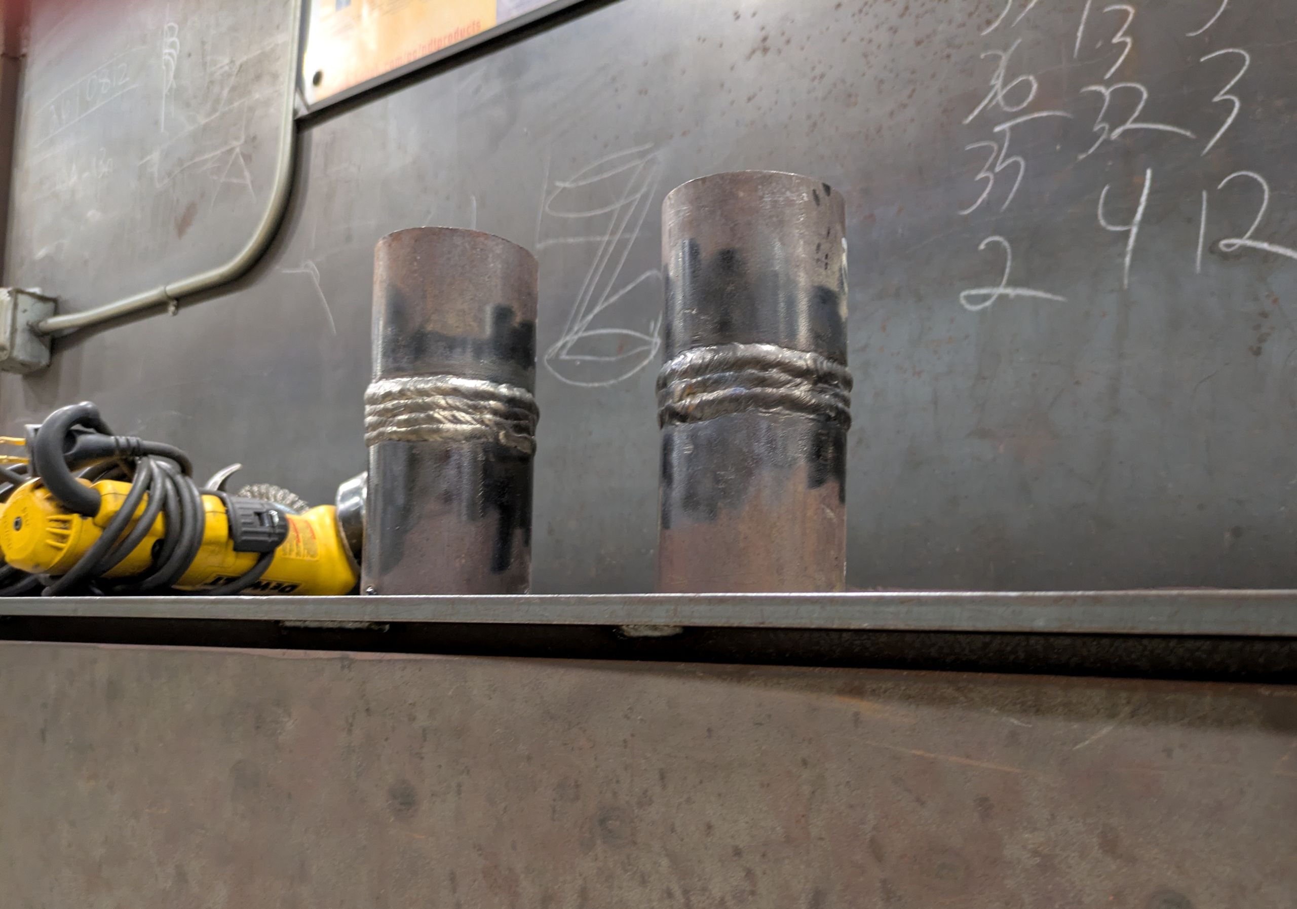 Completed weld test coupon prepared for welder qualification processing.